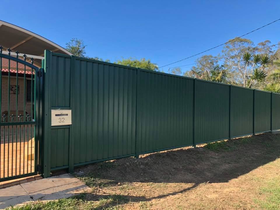 Dark green Colorbond fence run by Bennys Fencing in Ipswich